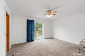 Primary bedroom with slider to back deck