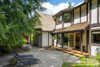 Patio and covered porch lead to the back yard and Studio entrance