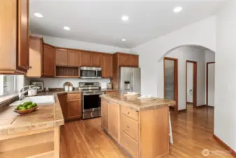 Kitchen offers plenty of storage in the maple cabinetry