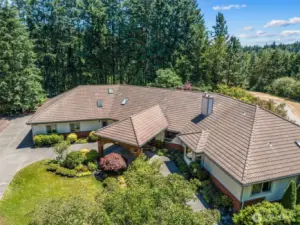 The portico to this home offers protection from the weather.