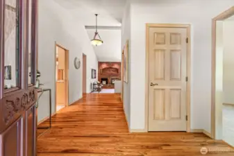 Stately entry with gleaming oak hardwood floors.