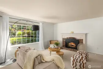 A cozy living room with fireplace offers a bright and comfortable setting for everyday relaxation.