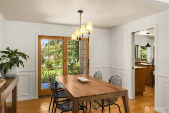 The dining room glows with natural light from oversized windows. A perfect balance of elegance and comfort, it’s equally suited for cozy family meals or festive holiday gatherings.