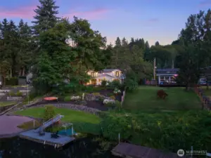 From above, the property’s prime riverfront location is revealed. Nestled in greenery, it offers unmatched privacy and direct access to the Sammamish River.