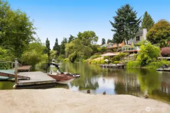 Golden sunlight reflects off the Sammamish River, creating an ever-changing canvas of color and movement. This is waterfront living at its most serene.