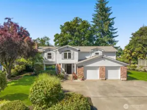 The front elevation showcases crisp siding, manicured landscaping, and a welcoming drive. Every detail reflects quality and care — this home is calling you.