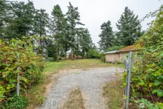 Driveway leading to back yard.