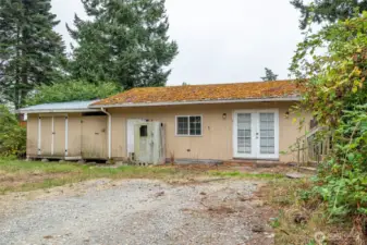 Detached building in backyard.