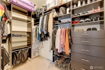 Walk in closet in the primary bedroom