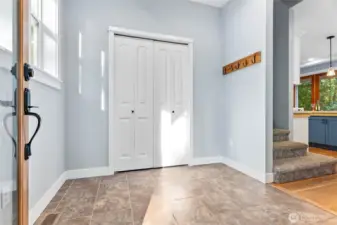 Large tile entry with nicely sized coat closet