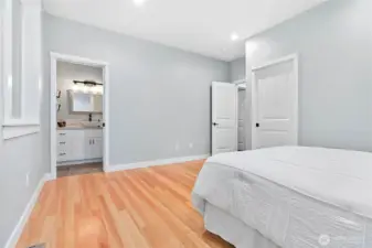 View of Primary bathroom, closet and doorway in primary bedroom