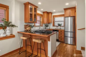Light-filled kitchen with a gas range.