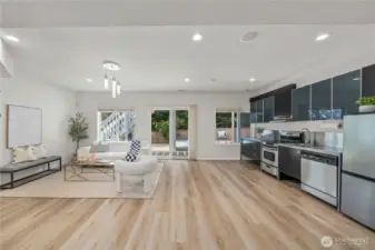 A spacious family room downstairs offers a comfortable gathering space for everyday living and entertaining.