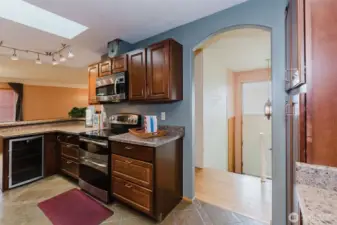 Stainless steel range, built-in microwave, and beverage refrigerator.