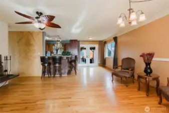Open living and dining areas with hardwood floors and natural light.