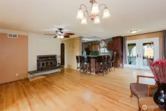 Spacious living room with fireplace and hardwood flooring.