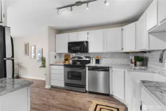 Quartz counter and beautiful white tile backsplash!