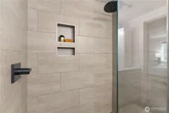 Imagine waking up to this tiled walk-in rain shower!