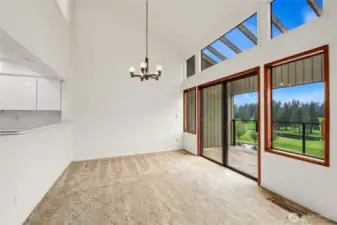 Dining area with slider to covered patio  Recessed lighting