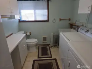 Laundry room, with half bath and extra storage