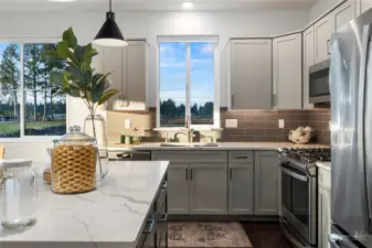 Thoughtfully designed with a modern flair, this kitchen features abundant quality cabinetry, a stainless steel, single large basin sink and garbage disposal and energy efficient appliances. Little things can go a long way, like eliminating the visibility of the microwave venting for a more clean & usable space.
