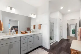 Prepare to be captivated by the dreamy Primary Bathroom! Revel in the expansive mirror, dual sink vanity boasting fabulous storage, stunning quartz counters, and luxurious toe-touch heating beneath.