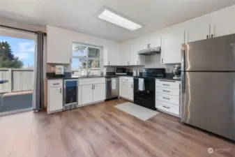 Stainless appliances are all included, including convenient beverage fridge! Fresh shaker cabinets (soft close!) and striking quartz counters combine to create a kitchen dreams are made of.