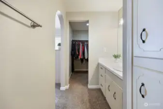 Primary side walk-in-closet seen here.