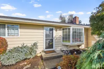 Home boasts a welcoming front entry with a great exterior color scheme.