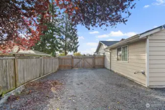 Massive space with gate access to the front yard, perfect for RV parking or extra cars.