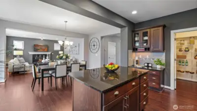 The kitchen island has a 2 spot eating bar.  There is a very useful built-in desk next to the spacious walk-in pantry.