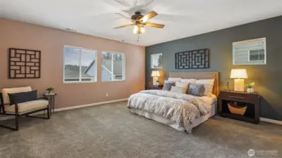 The primary bedroom is extra large that will fit any sized bed and furniture.  There is a ceiling fan and custom paint.