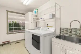 Laundry/mud room near garage door entrance.
