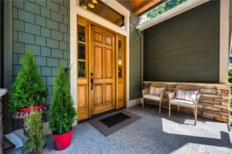 Beautiful front porch entry with a gorgeous Craftsman door.