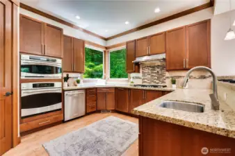 The kitchen boasts a very large pantry and stainless appliances.
