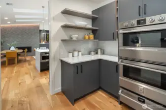Enjoy the convenience of double ovens and a warming drawer in the fully outfitted butler’s pantry