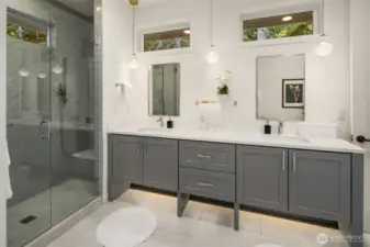 Luxurious primary suite featuring a 5-piece spa-inspired bathroom and a spacious walk-in closet