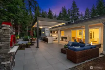 And now for the exterior! Enjoy the luxury of a show-stopping outdoor culinary space featuring a pizza oven and high-end appliances