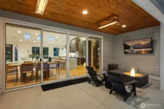 Among the five outdoor entertainment spaces, this covered pad offers built-in heaters and a cozy fire bowl for year-round comfort