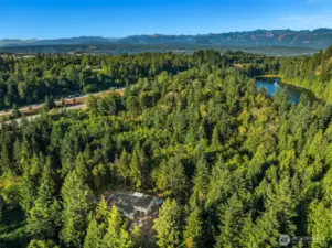 Set on 1.6 acres with rare access to serene Echo Lake, shared by only a privileged few, and private walking trails