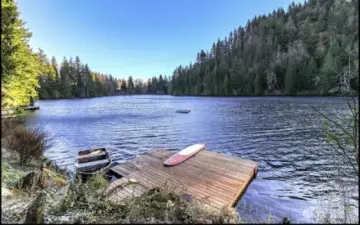 Echo Lake is a tranquil, motorless alpine lake with no public access—an exclusive retreat shared by just six fortunate homeowners