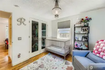 Glass closet doors add interest and personality to the space!