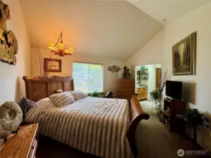 Very spacious vaulted primary bedroom with plenty of room for a king size bed.