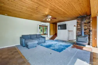 Large windows with natural light and gorgeous cedar plank ceilings