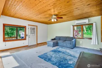Large windows with natural light and gorgeous cedar plank ceilings
