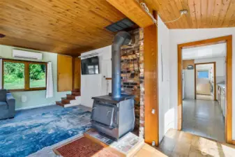 Large windows with natural light and gorgeous cedar plank ceilings