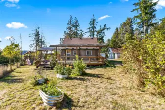 Huge yard with raised garden beds