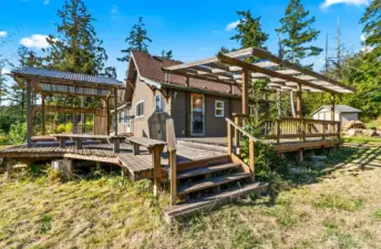 Huge yard with raised garden beds and large deck