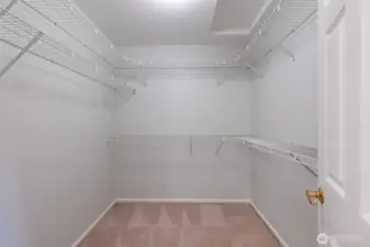 Spacious walk in closet in the primary