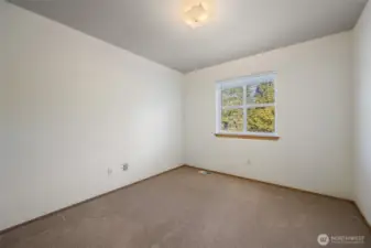 The third bedroom, overlooking the treed backyard!